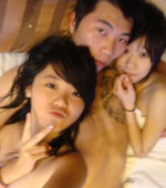 Gangster looking guy with two naked Chinese girls