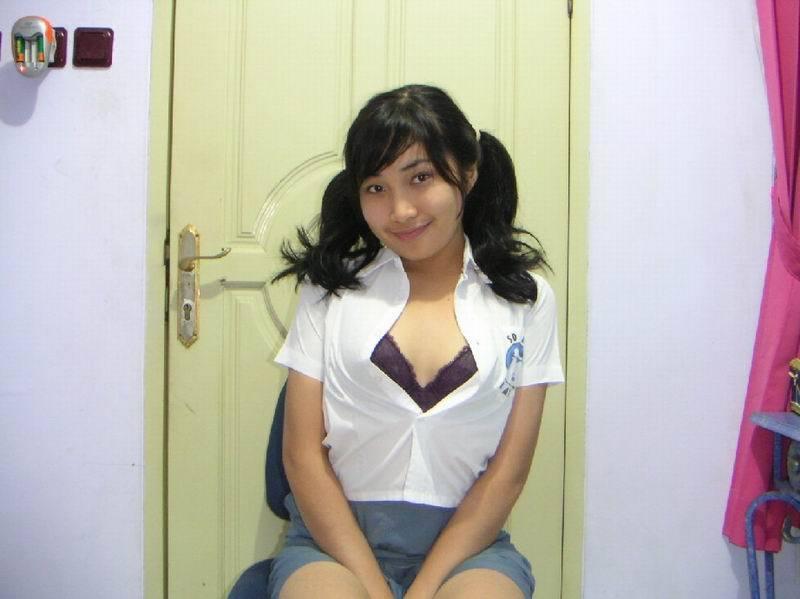 Indonesian Wild Girl - Cute Asian schoolgirl in uniform spreads pussy | Asian Porn Times
